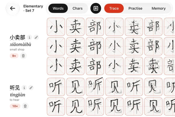 Trace, on iPad: the Trace tab selected; grey model characters in every square, handwriting over them